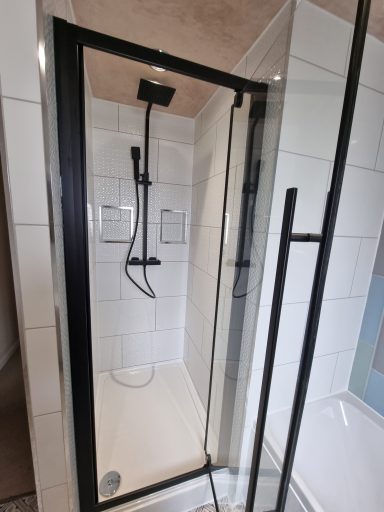 Modern matt black shower enclosure with matt black shower